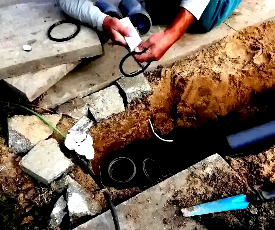 Hands assembling French Drain Installation Lexington, KY